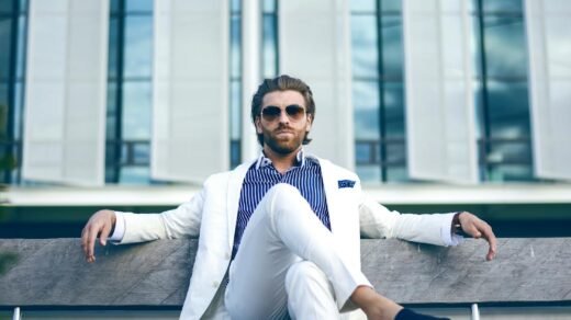 man wearing white suit jacket and white pants