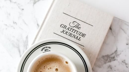 cozy coffee and gratitude journal on marble