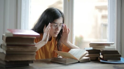 a weary female student having a headache