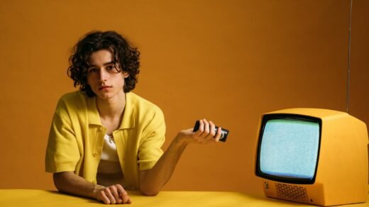 young man holding a remote control