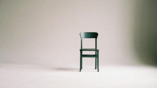 wooden chair on a white wall studio